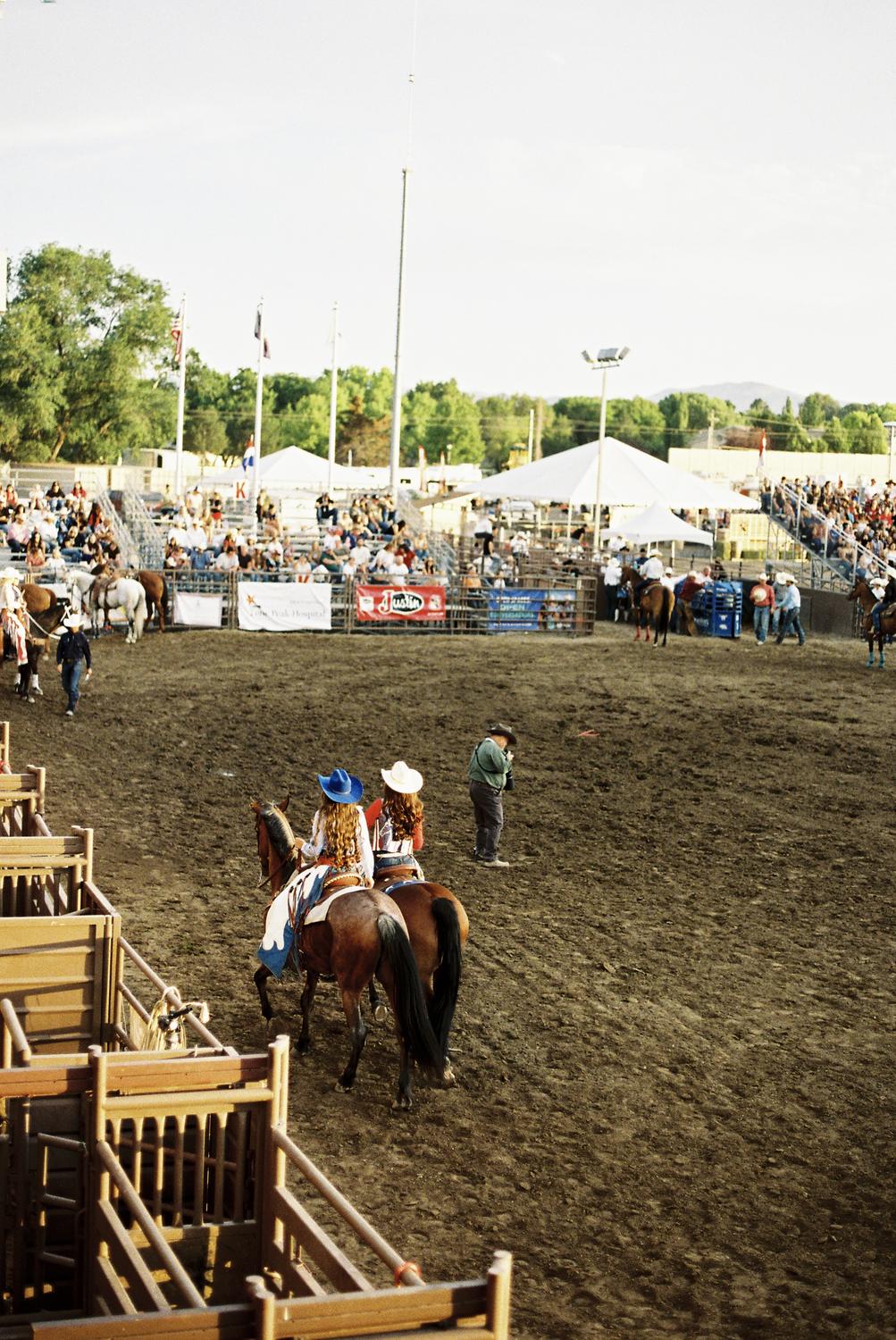Rodeo queens riding into the arena ahead of the grand entry