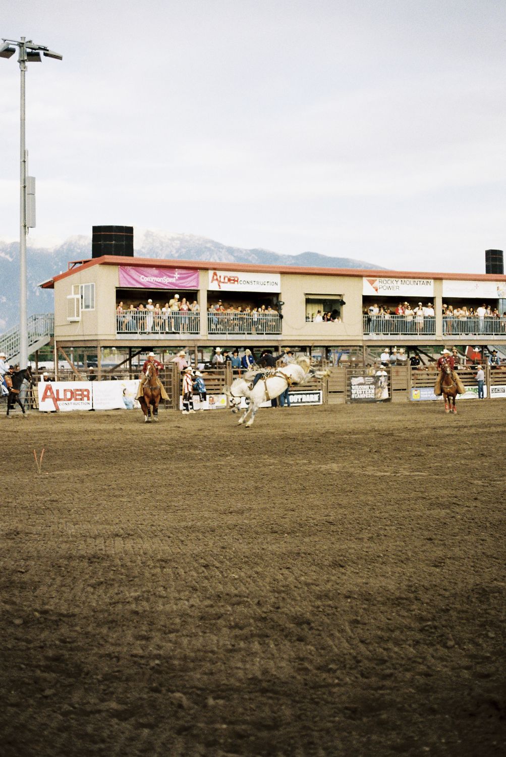 Bareback rider coming out of the chute at the Western Stampede